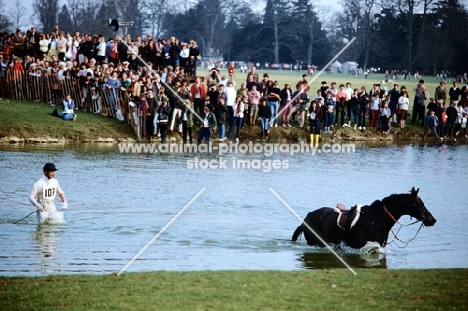 badminton 1980, rider retrieving  his horse at the lake during cross country
