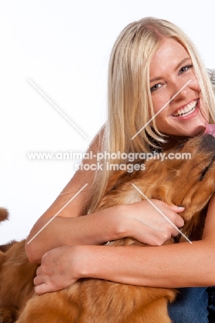 woman and her golden retriever