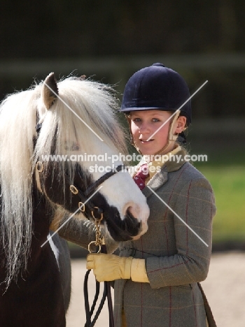 Piebald horse with rider