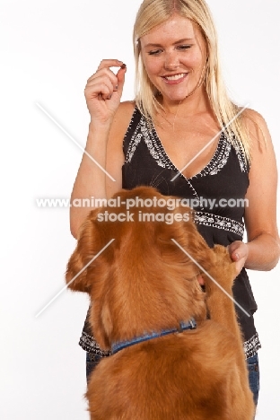 woman and her golden retriever