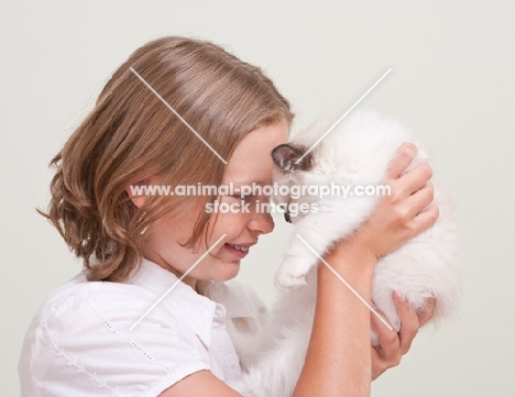 girl with Ragdoll kitten