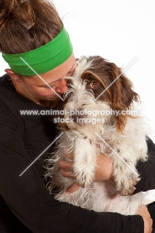 woman hugging her young German Wirehaired Pointer
