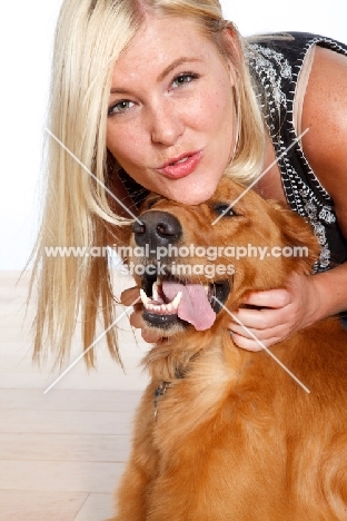 woman and her golden retriever