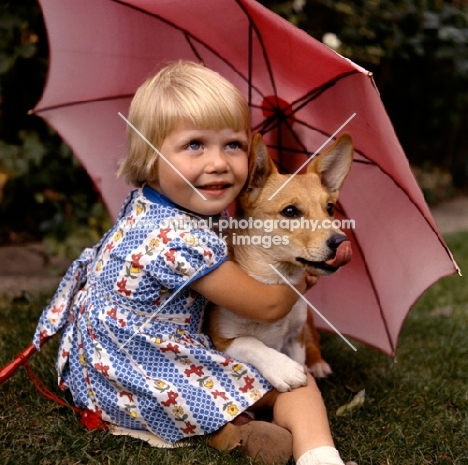 girl and corgi under parasol