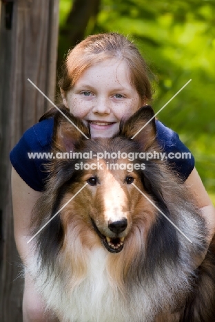 Rough Collie with proud girl