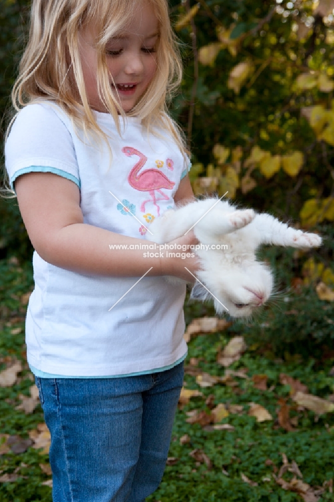 girl holding a Ragdoll