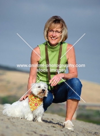 West Highland White Terrier with owner