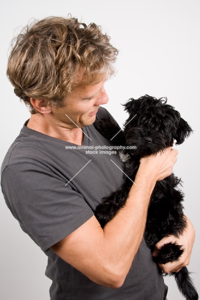 Man holding puppy