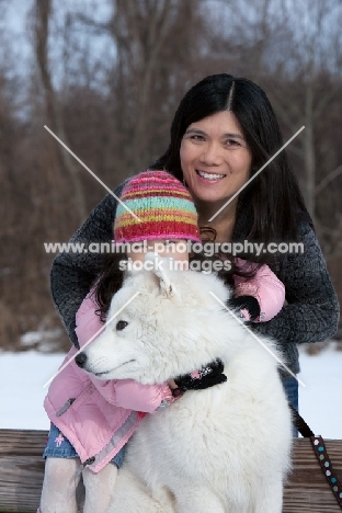 young Samoyed with girl and woman