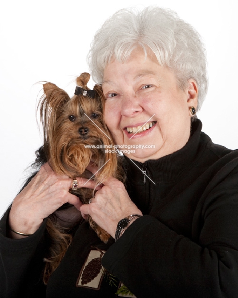 elderly lady holding a yorkshire terrier