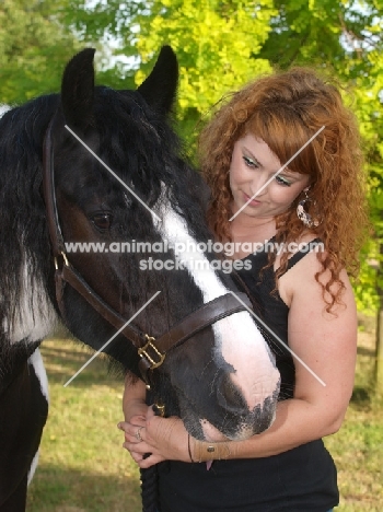 Piebald horse with woman