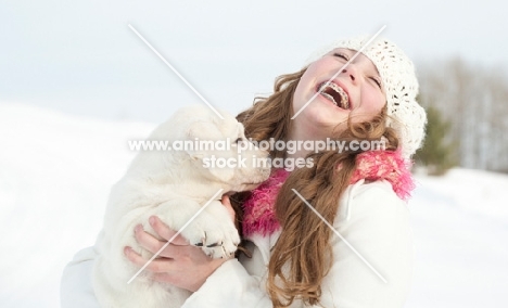 Labrador puppy with girl, in winter