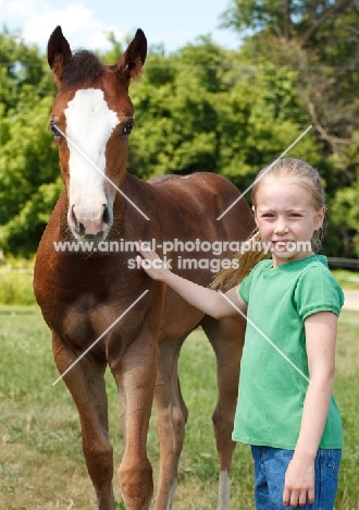 girl with Appaloosa foal