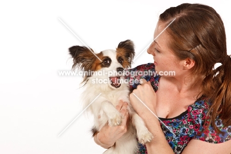 Papillon and woman