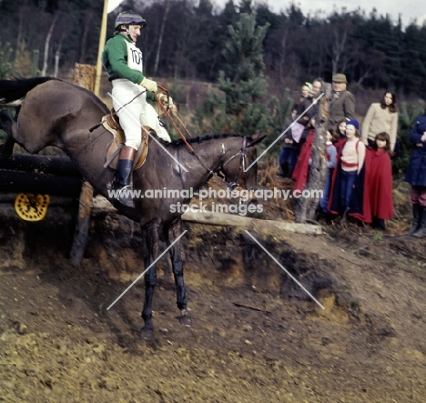 tweseldown racecourse, crookham horse trials 1975
 novice, landing at drop fence

