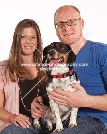 man and woman with their Dachshund x Beagle mix (also known as Doxle, Doxie, Beaschund)