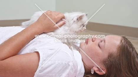 girl lying down with Ragdoll