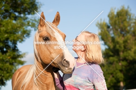 Palomino Quarter horse with woman
