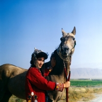 Picture of akhal teke with a woman