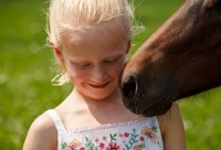 Picture of Appaloosa horse near girl