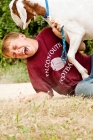 Picture of Boy laughing and playing with his Boer goat.