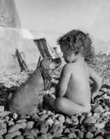 Picture of child and puppy at the beach