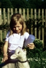 Picture of child feeding a lamb with a bottle