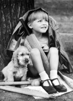 Picture of Cocker Spaniel puppy with boy, waiting for rain to stop