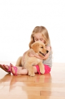 Picture of Girl with Golden Retriever puppy