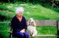 Picture of grey haired lady with her cocker spaniel