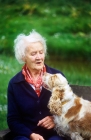 Picture of grey haired lady with her cocker spaniel