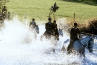 Picture of horses and riders out with the berks and bucks drag hunt crossing water