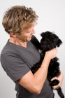 Picture of Man holding puppy