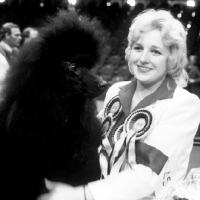 Picture of marita rogers with ch montravia tommy gun after winning crufts bis 1985