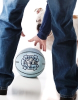 Picture of owner playing with English Bulldog and ball