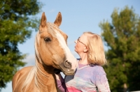 Picture of Palomino Quarter horse with woman
