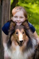 Picture of Rough Collie with proud girl