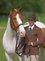 Picture of Skewbald horse and woman