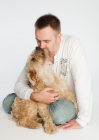 Picture of Wheaten Terrier licking owners face