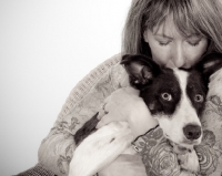 Picture of woman cuddling a border collie