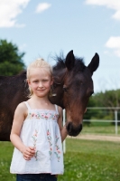 Picture of young Appaloosa horse and girl