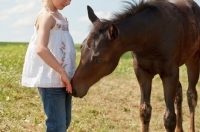 Picture of young Appaloosa horse with girl