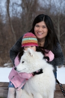 Picture of young Samoyed with girl and woman